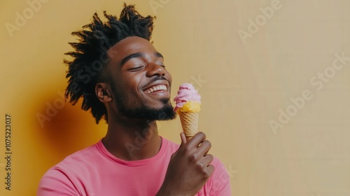 man eating fruity ice cream against a solid wallwith joyful expression, photo