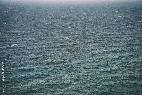 Rain over the stormy sea, abstract dark background landscape