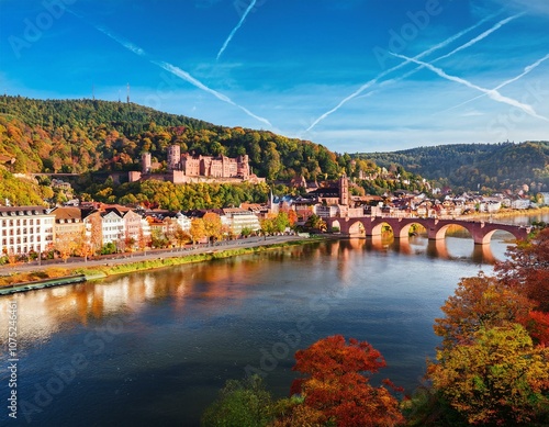 city of heidelberg with heidelberg castle and neckar river in autumn season photo