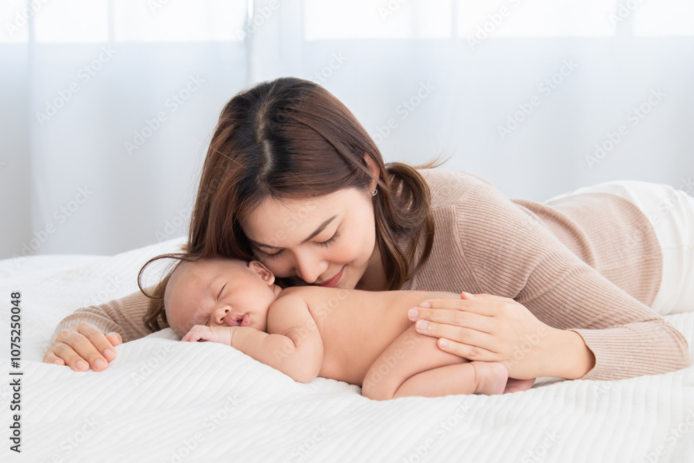 Adorable sleeping baby comfortable on bed in mother arm nursing, young Asian beautiful mom lying down hug infant 0-1 month with love, gently, tenderly, cuddle, bonding, caring motherhood nurturing Adorable sleeping baby comfortable on bed in mother arm nursing, young Asian beautiful mom lying down hug infant 0-1 month with love, gently, tenderly, cuddle, bonding, caring motherhood nurturing