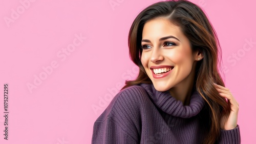 A woman in a purple sweater smiles while looking to the side