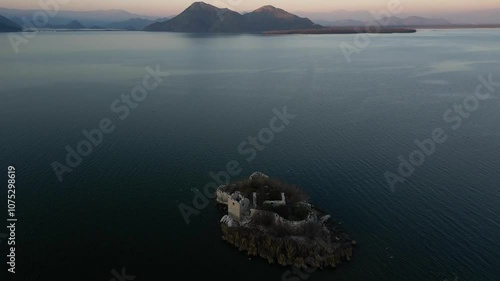 Aerial panoramic view of the island fortress Grmozur standing in the middle of Lake Skadar in Montenegro photo