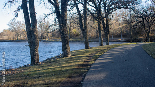 Wallpaper Mural "A Walk in an Autumn Park by a Lake": These photographs depict a peaceful walk through an autumn park located next to a lake. The golden and red leaves of the trees create a warm and cozy atmosphere.  Torontodigital.ca