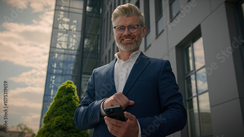 Bilde på lerret Caucasian happy euphoric mature middle-aged business man celebrate mobile win ex