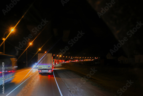 Rows of cars stuck in traffic on the highway, mostly trucks photo