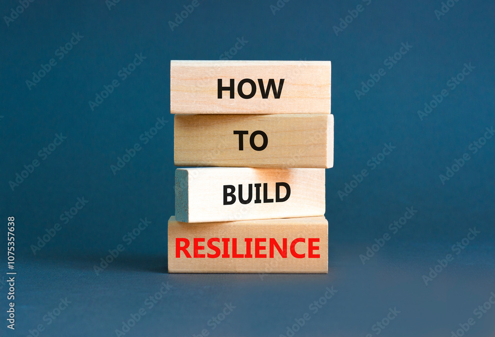 How to build resilience symbol. Concept words How to build resilience on beautiful wooden blocks. Beautiful grey table grey background. Business and how to build resilience concept. Copy space. How to build resilience symbol. Concept words How to build resilience on beautiful wooden blocks. Beautiful grey table grey background. Business and how to build resilience concept. Copy space.