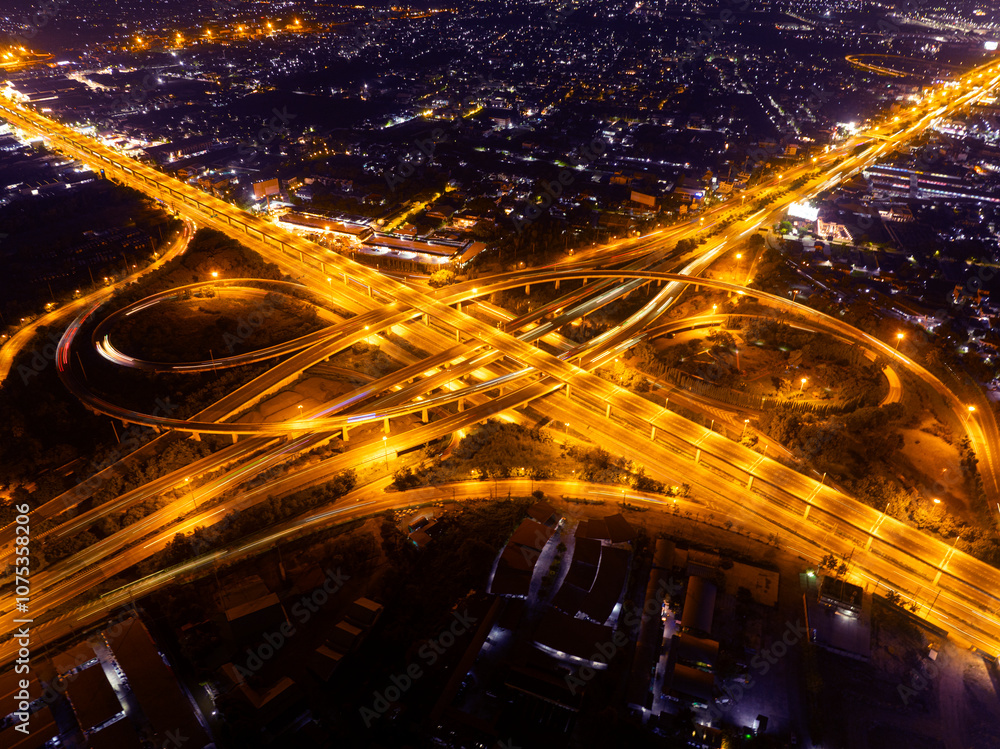 Fototapeta premium Time lapse,Hyperlapse, Of traffic on city streets at night. Aerial view and top view of traffic on freeway, Expressway top view, Road traffic an important infrastructure