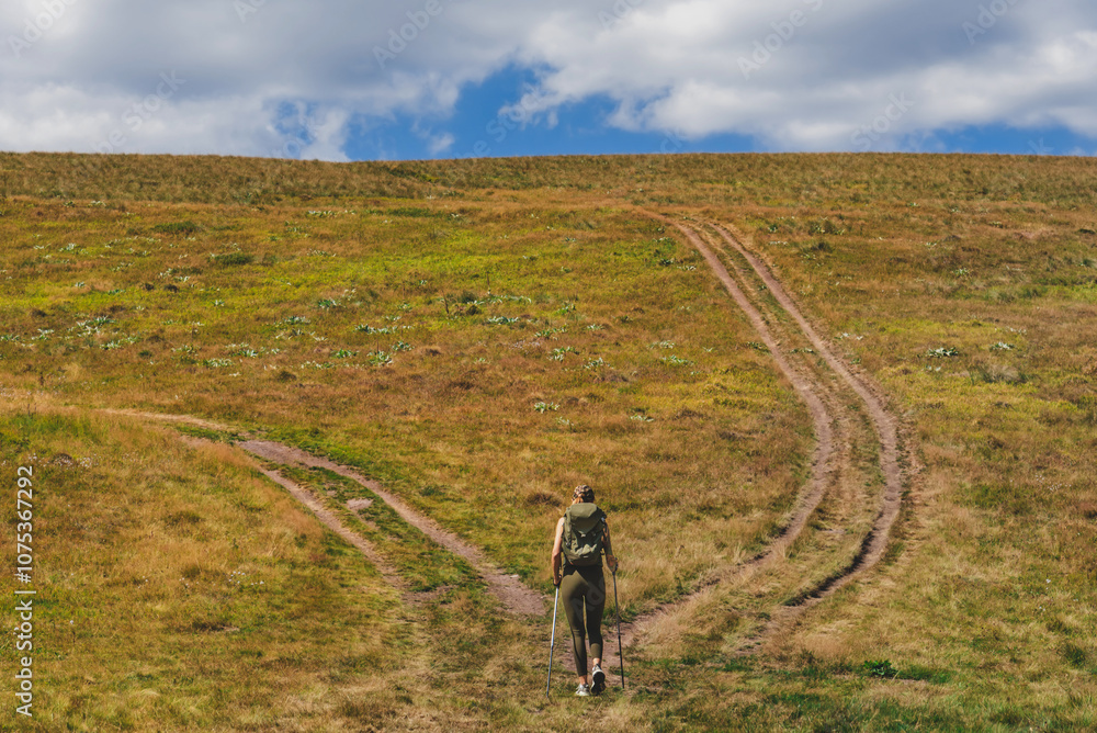 Female Tourist Walking on Mountain Trekking Trail
