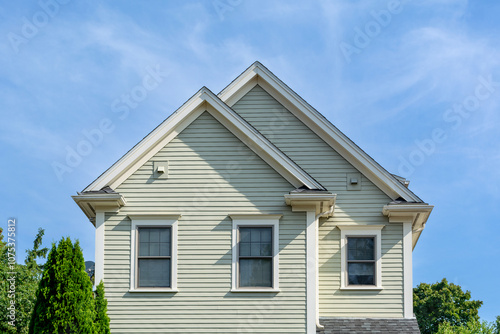 Elegant clapboard-sided home with dual gable roofs in Brighton, Massachusetts, USA