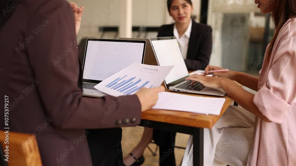 Asian businesswoman teamwork working together on table with analysis report and advisor showing plan, Business marketing and finance at meeting room of the workplace concept. Asian businesswoman teamwork working together on table with analysis report and advisor showing plan, Business marketing and finance at meeting room of the workplace concept.