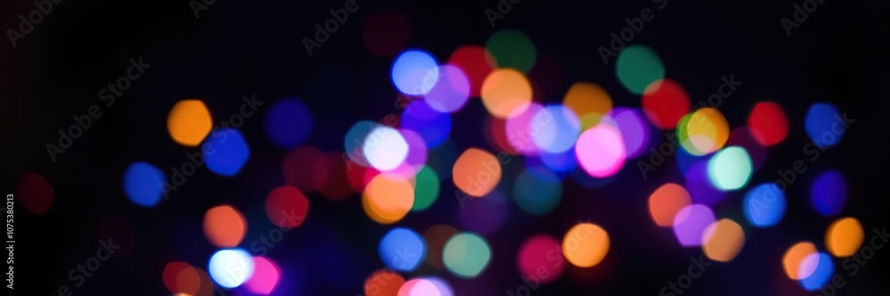 A cluster of multi-colored lights with a blurred effect against a dark background, light installation, night scene A cluster of multi-colored lights with a blurred effect against a dark background, light installation, night scene