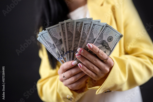 Wallpaper Mural cheerful young caucasian woman hold dollar money isolated on black. Torontodigital.ca