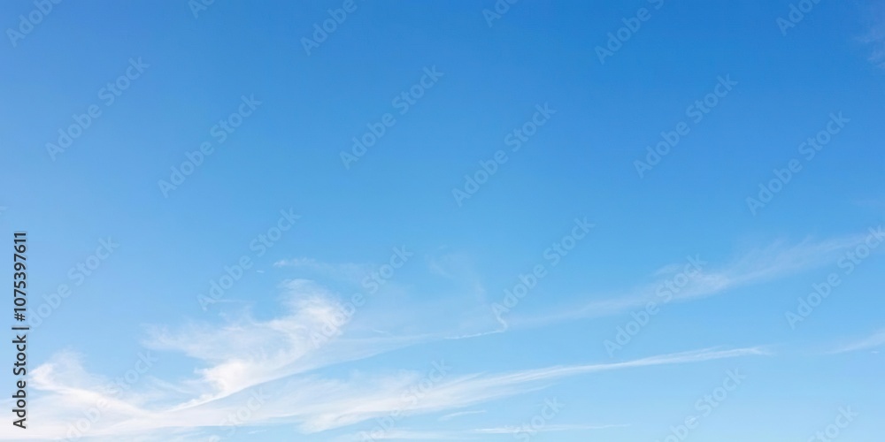 clear blue sky with thin high-level clouds stretching across it, soft focus, aerial view clear blue sky with thin high-level clouds stretching across it, soft focus, aerial view