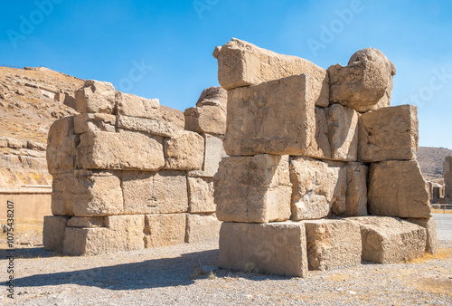 Persepolis, beautiful stone archway stands tall with a blue sky, Iran