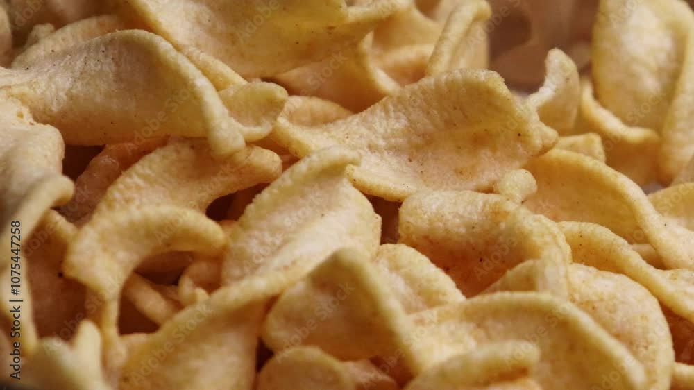Falling potato chips to the glass bowl close up shot. Unhealthy fast food. Premium Potato Chips Falling Down on Abstract Brown Background at 1000fps.
Falling potato chips to the glass bowl close up shot. Unhealthy fast food. Premium Potato Chips Falling Down on Abstract Brown Background at 1000fps.