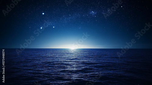 Star-filled deep blue night sky over sea tranquil background. 