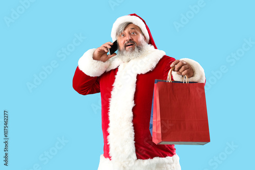 Santa Claus with shopping b...