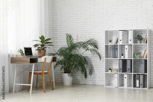 Remote work and home office setup, modern workspace with laptop and desk in b...