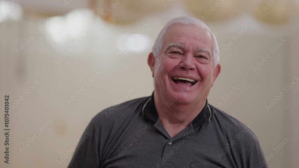 Casual Caucasian Senior Man in His 70s Laughing Spontaneously, Close-Up Smiling Face Casual Caucasian Senior Man in His 70s Laughing Spontaneously, Close-Up Smiling Face