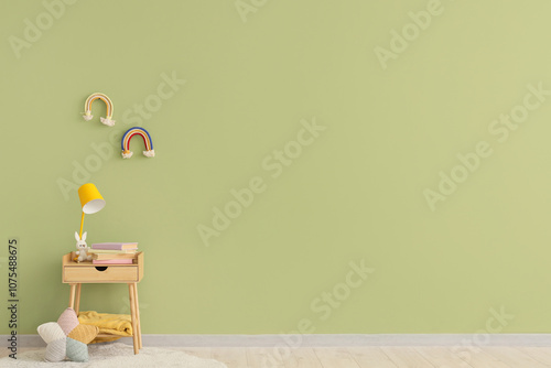 Lamp with toy and books on ...