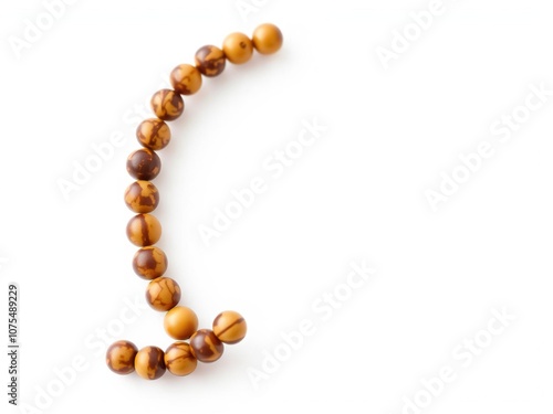 Close-up shot of brown bead ring set against a clean white backdrop, close-up, design element