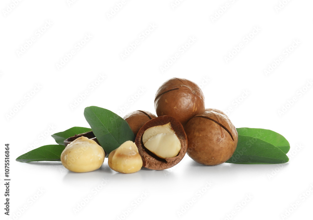 Tasty macadamia nuts and leaves on white background Tasty macadamia nuts and leaves on white background