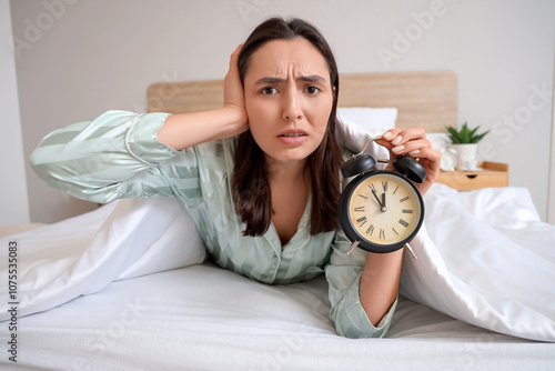 Displeased young woman in g...