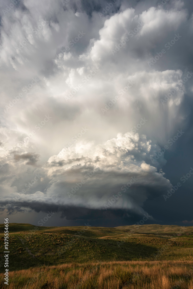 A tall storm spins over the Nebraskan Sandhills late in the afternoon. A tall storm spins over the Nebraskan Sandhills late in the afternoon.
