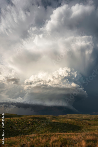 A tall storm spins over the Nebraskan Sandhills late in the afternoon.