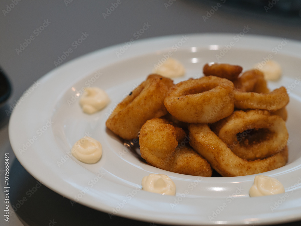 a plate of fried squid a plate of fried squid
