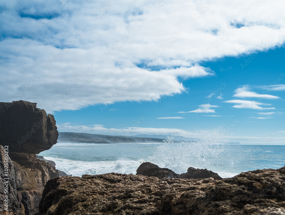 Atlantic Ocean waves whipping white foam against the rocky shore, Ericeira, Portugal. Atlantic Ocean waves whipping white foam against the rocky shore, Ericeira, Portugal.