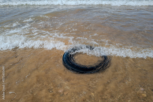 Old car tire on the beach in Morocco