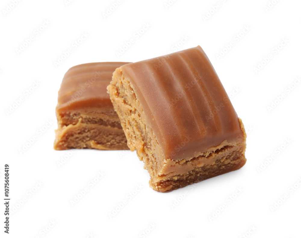 Tasty sweet caramel candies isolated on white Tasty sweet caramel candies isolated on white
