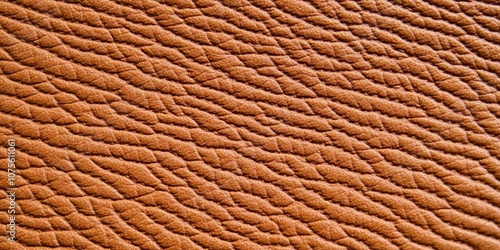 Close-up view of rich brown leather texture highlighting intricate details and warm lighting effects