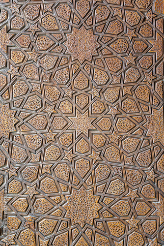 A closeup of a beautifully crafted wooden door with a unique pattern