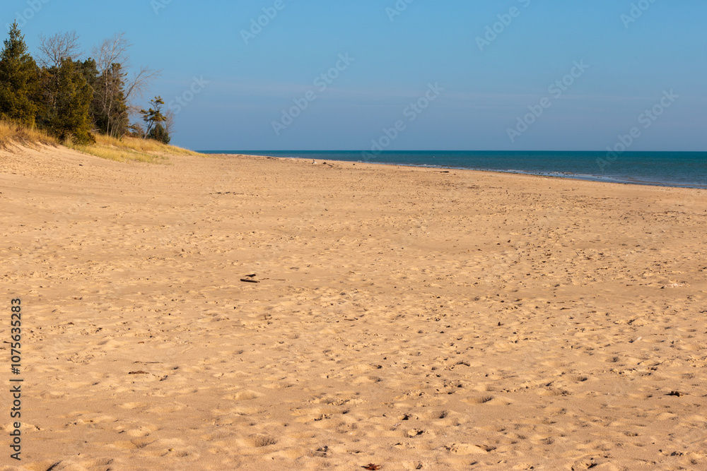Looking north over the beach and Lake Michigan in early November within Kohler-Andrae State Park, Sheboygan, Wisconsin Looking north over the beach and Lake Michigan in early November within Kohler-Andrae State Park, Sheboygan, Wisconsin