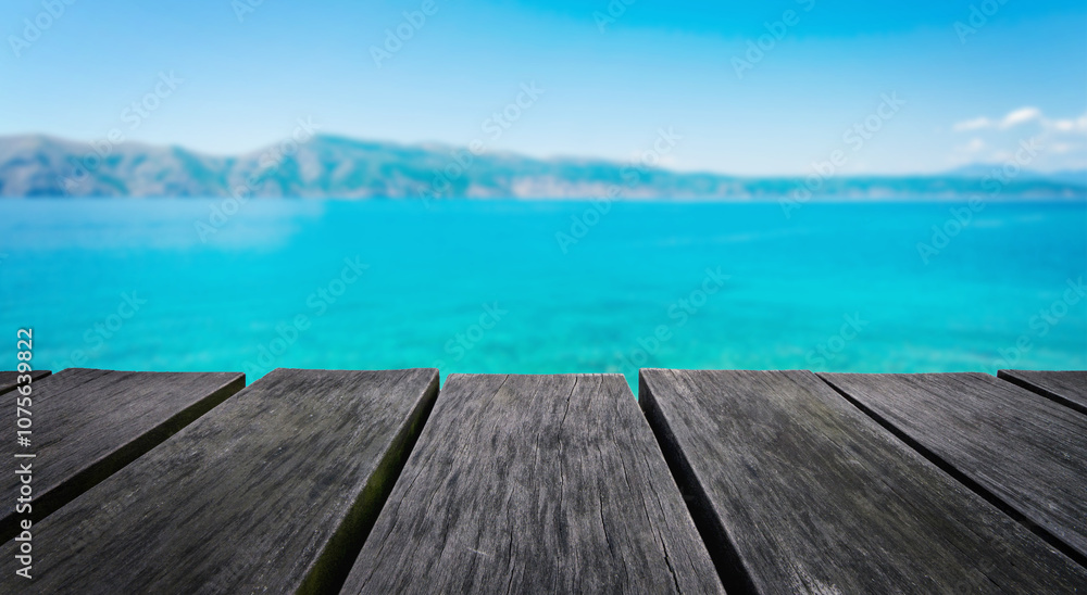 Empty wooden table with blurred beach background Empty wooden table with blurred beach background