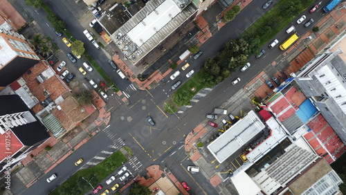 Aerial view of an urban intersection with streets and traffic flows in the high altitude Andean city Bogota, Colombia, South America.