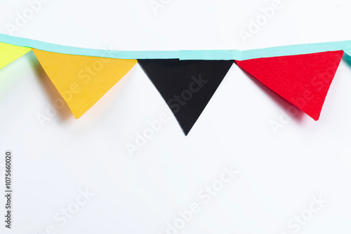 Colorful paper garland on a white background with space for text Free Download Colorful paper garland on a white background with space for text - GFXLoad
