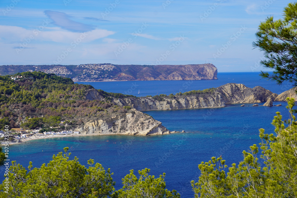 Fototapeta premium Coastal Bay with Cliffs and Vibrant Blue Waters