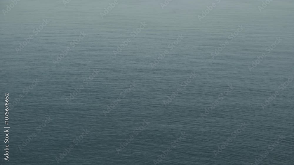 Aerial view to calm rippling blue Mediterranean sea water. Abstract water surface background Aerial view to calm rippling blue Mediterranean sea water. Abstract water surface background