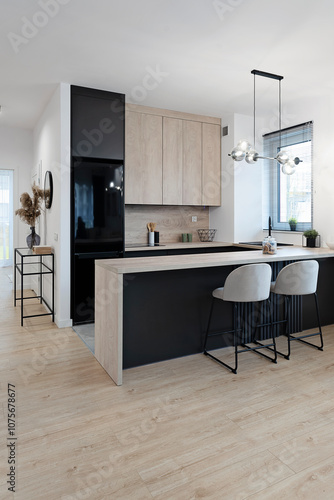  Modern dining room with table, chairs, kitchen and wooden floor. Design and minimalist furniture in new apartment with window, Real estate. Nobody.