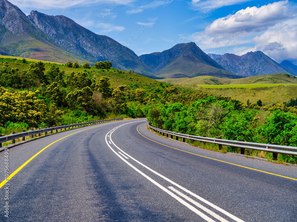 Naklejka premium Rural Swellendam winding road with Langeberg Mountains in the background, Western Cape, South Africa