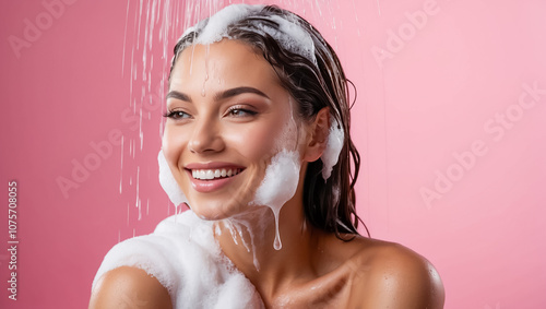 beautiful young woman washing her hair with shampoo