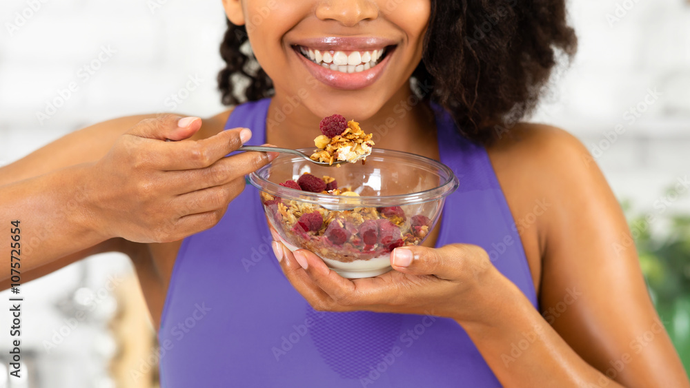 Healthy Meal Concept. Close up cropped portrait of unrecognizable african lady eating granola Healthy Meal Concept. Close up cropped portrait of unrecognizable african lady eating granola