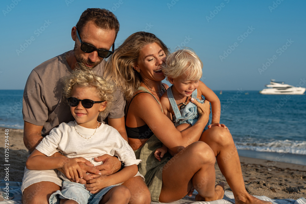 Family Enjoying Playful Moments on the Beach by the Sea Family Enjoying Playful Moments on the Beach by the Sea