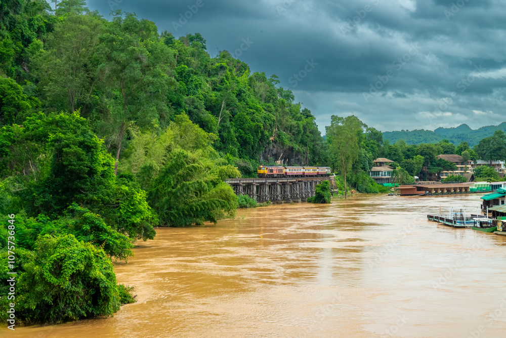 Naklejka premium Trains running on death railways track crossing kwai river in kanchanaburi thailand this railways important destination of world war II history builted by soldier prisoners.