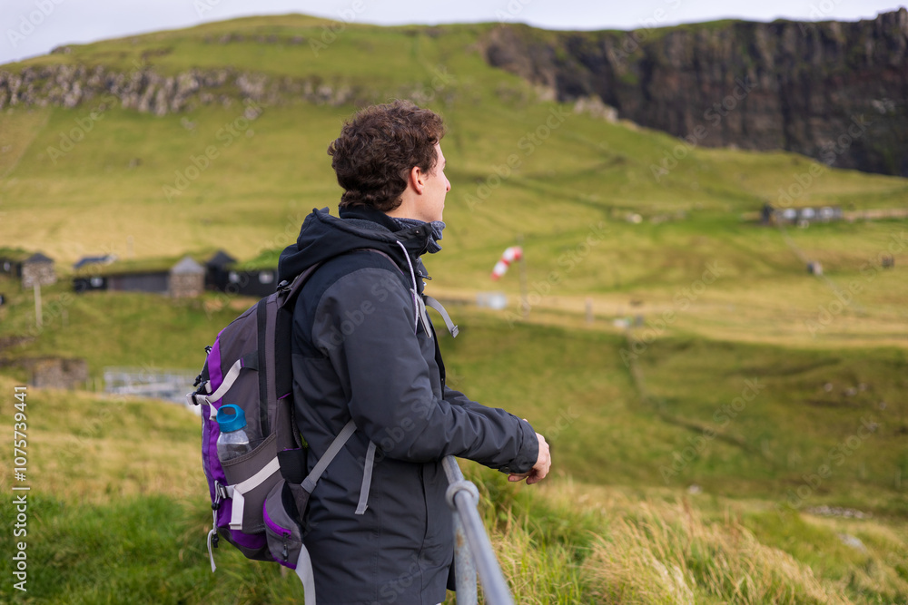 Solo traveler on Mykines in the Faroe Islands Solo traveler on Mykines in the Faroe Islands