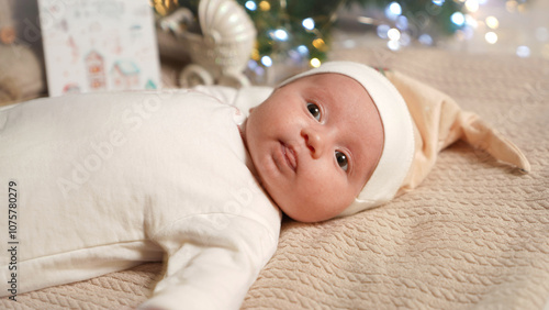 Newborn baby lies on Christmas and New Year Eve.
