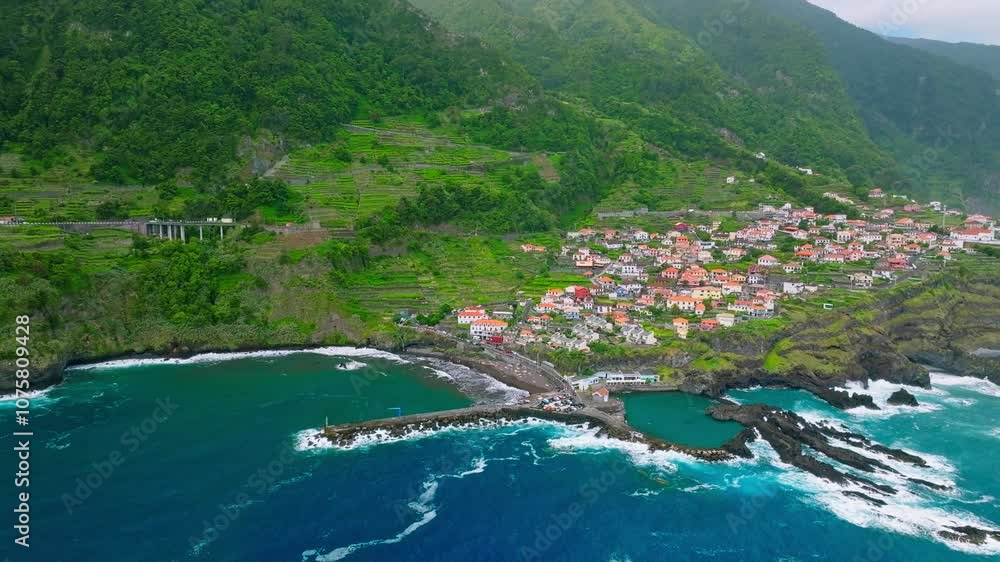 Aerial drone shot of Seixal village on Atlantic ocean coast on Madeira island, Portugal. Slide trucking shot Aerial drone shot of Seixal village on Atlantic ocean coast on Madeira island, Portugal. Slide trucking shot